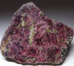 Photo of Eudialyte a complex REE bearing silicate mineral found in Alkaline Rocks